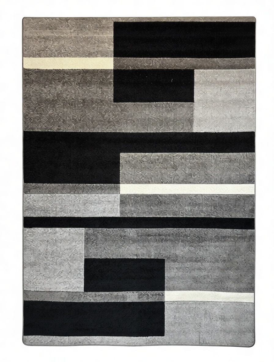 CarpetlyHome modern szürke geometriai mintás szőnyeg, fekete, szürke és fehér színben, 100% polipropilénből.